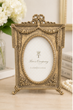 Antique Gold Bow Oval Picture Frame by Two's Company
